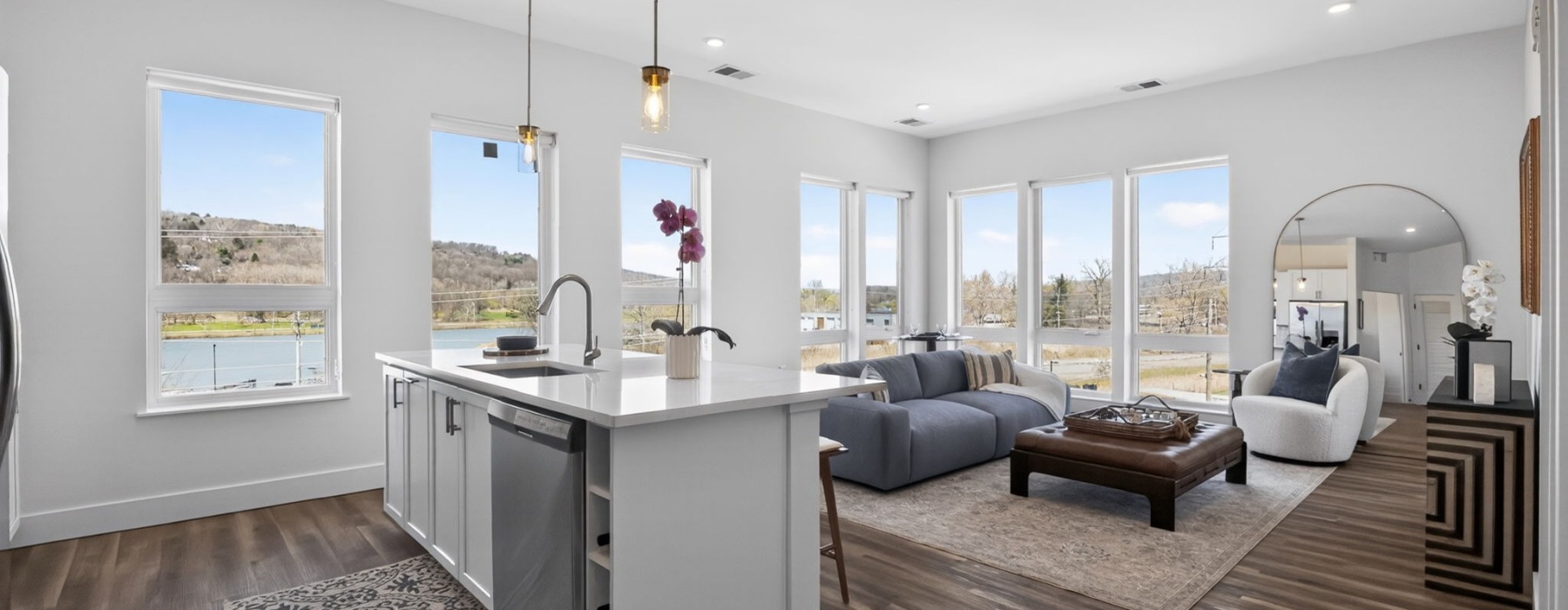 open living concept showing living room and kitchen combined with ample space for seating and modern living room decor