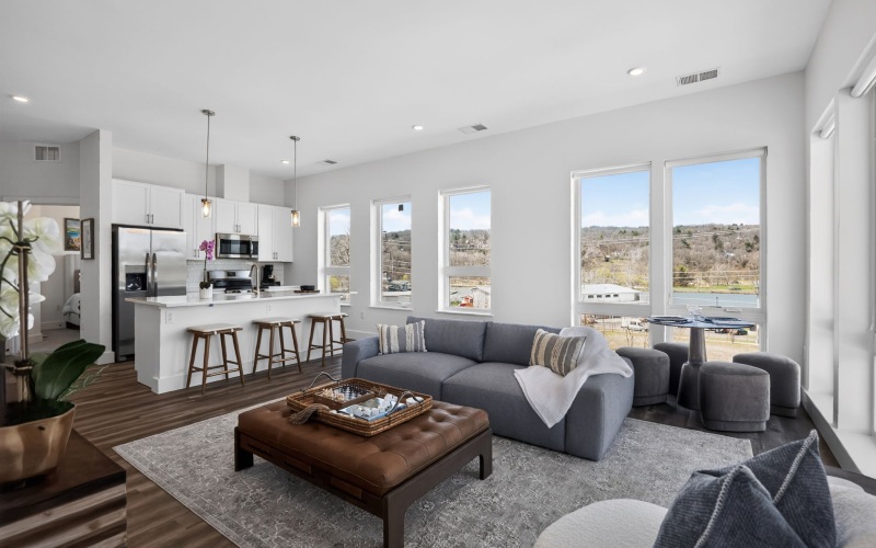 living room with couch coffee table and large area rug