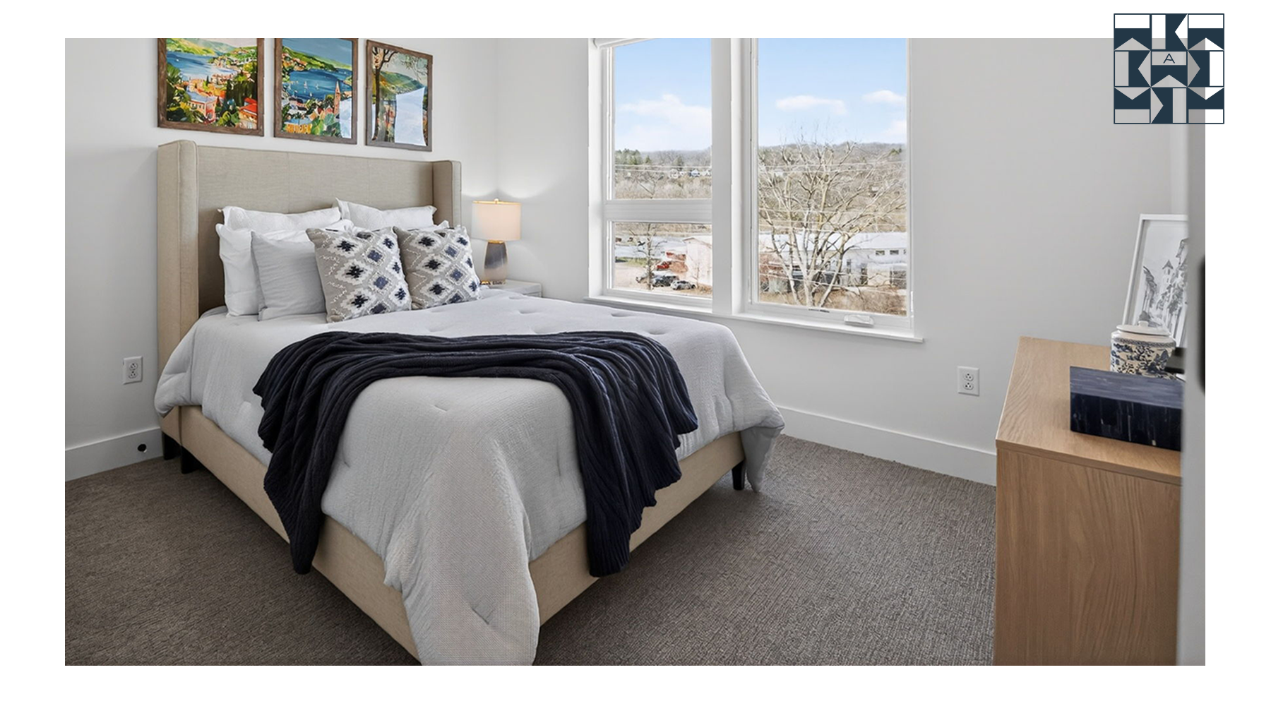 bedroom with a large window and modern decor