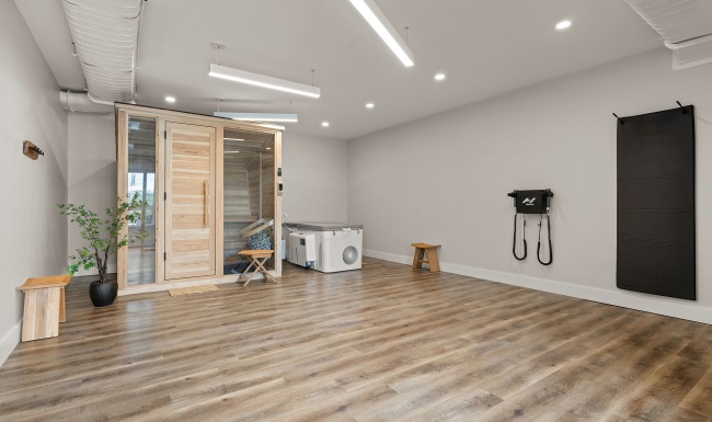 a room with wood floors and a wood cabinets with glass windows